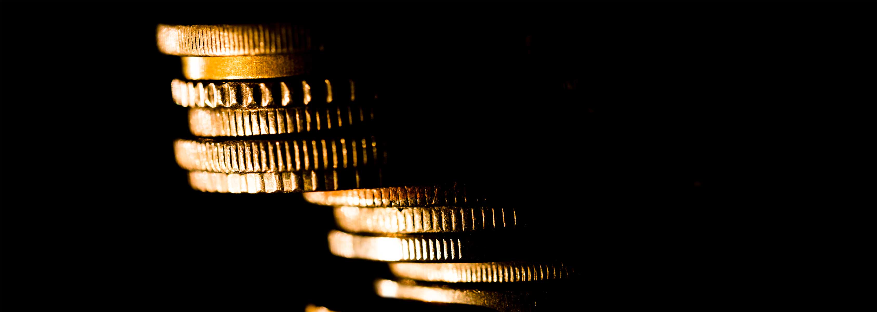 Stack of Gold coins leaning on an angel 