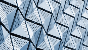 Metallic, geometric architectural panels on an office building