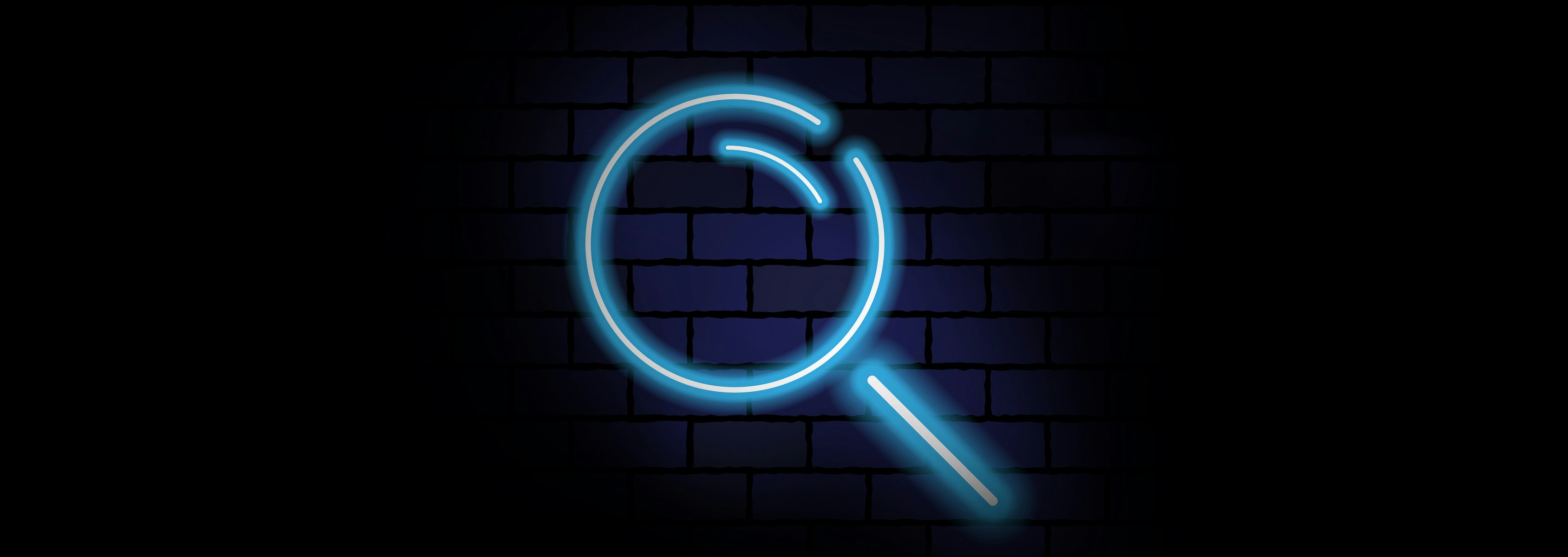 Neon Magnifying glass on a brick wall