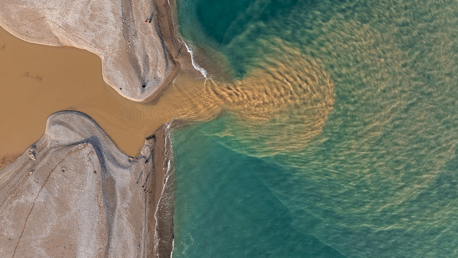 A river flowing into the ocean