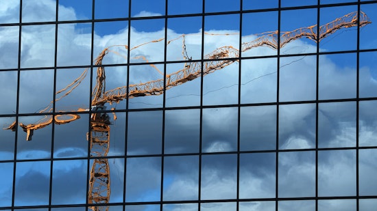 reflection of crane on building