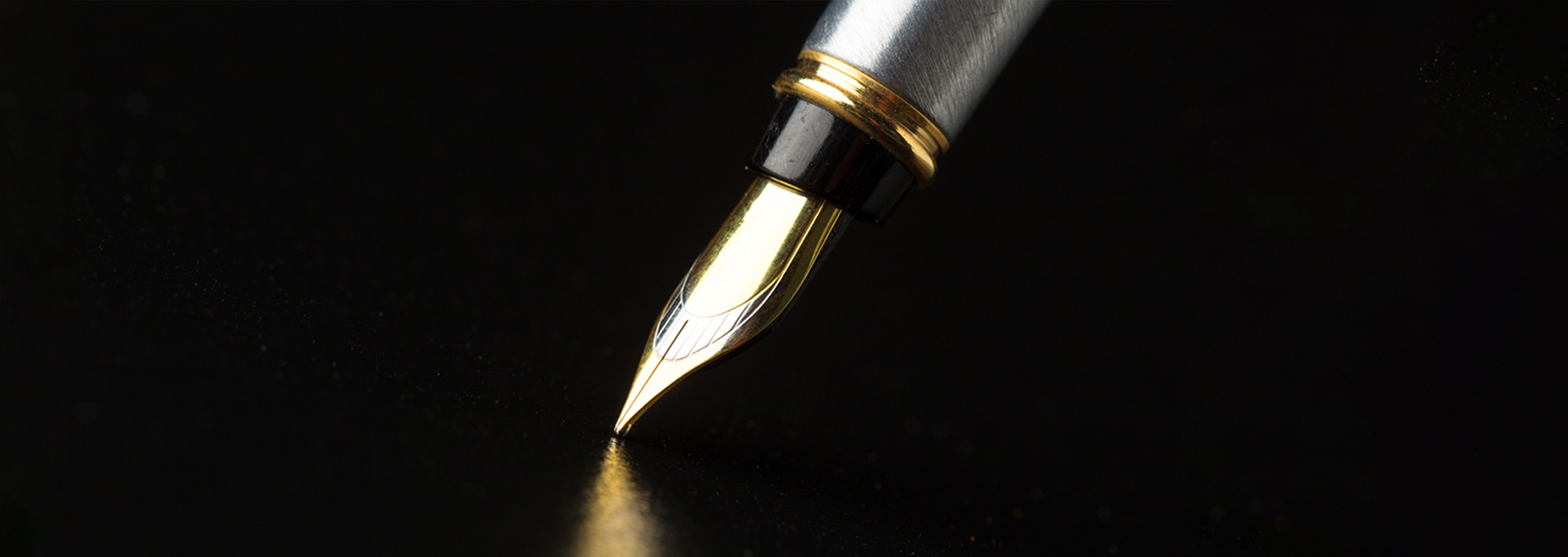 An image of a pen writing. 