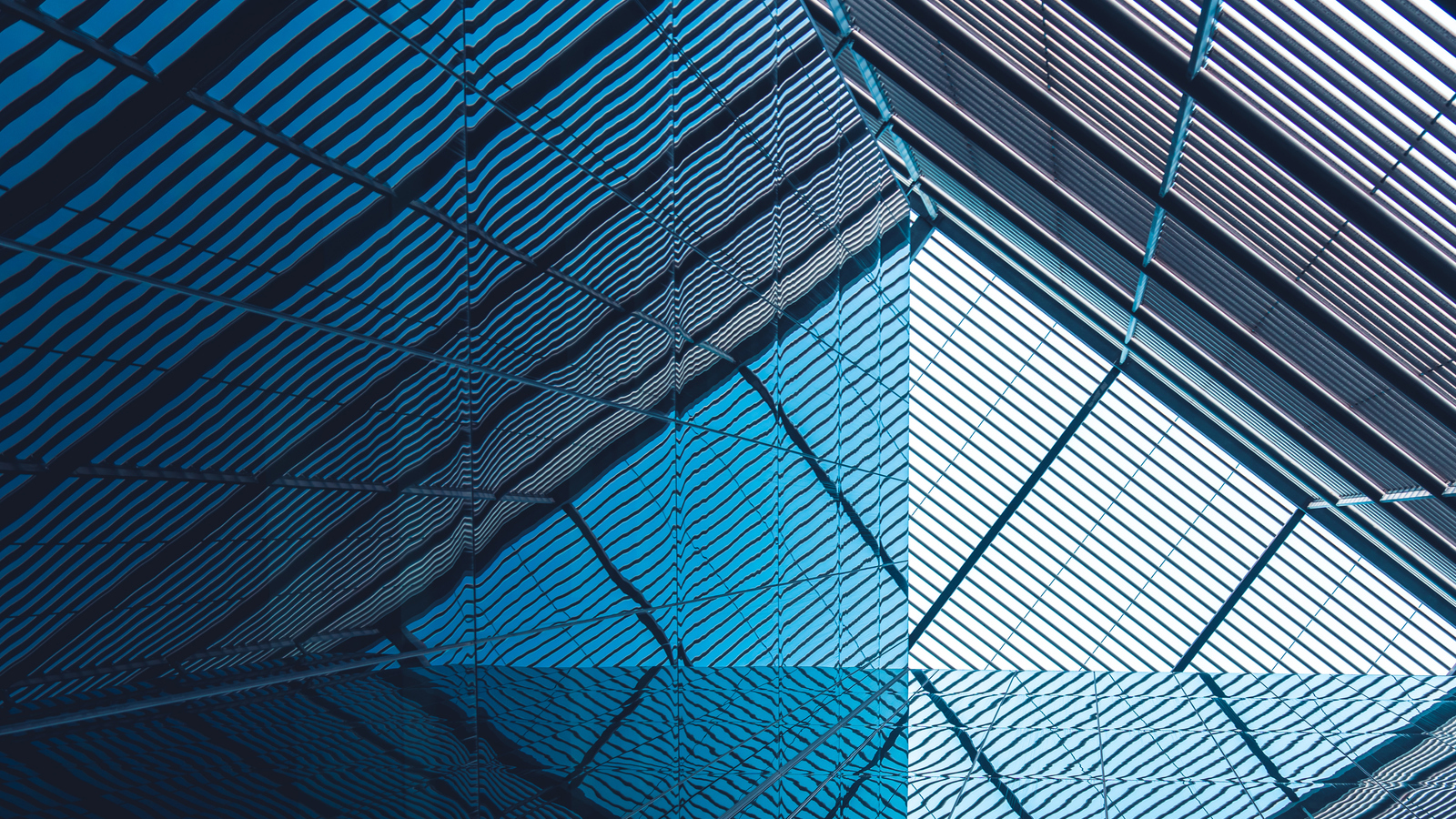 Abstract, angular architecture: blue, sloping panes on an office building in London