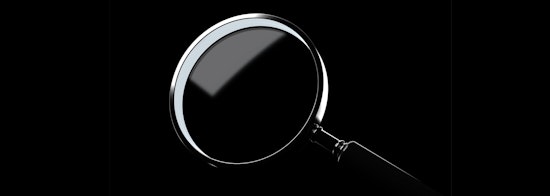 A magnifying glass centred on a black background.