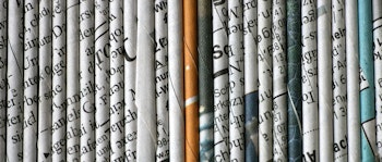 rolled newspaper pages