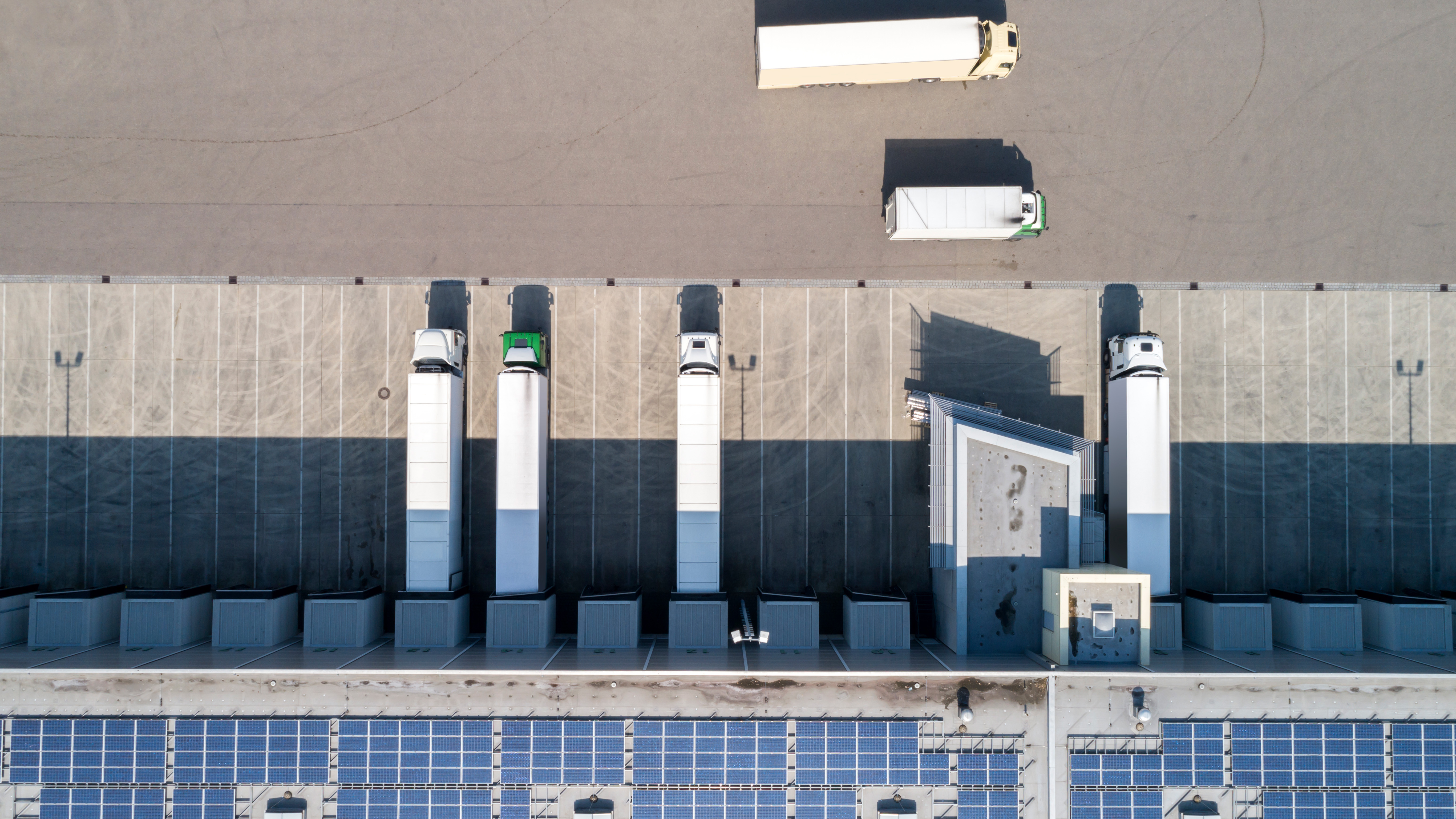 Aerial view of semi trucks at warehouse