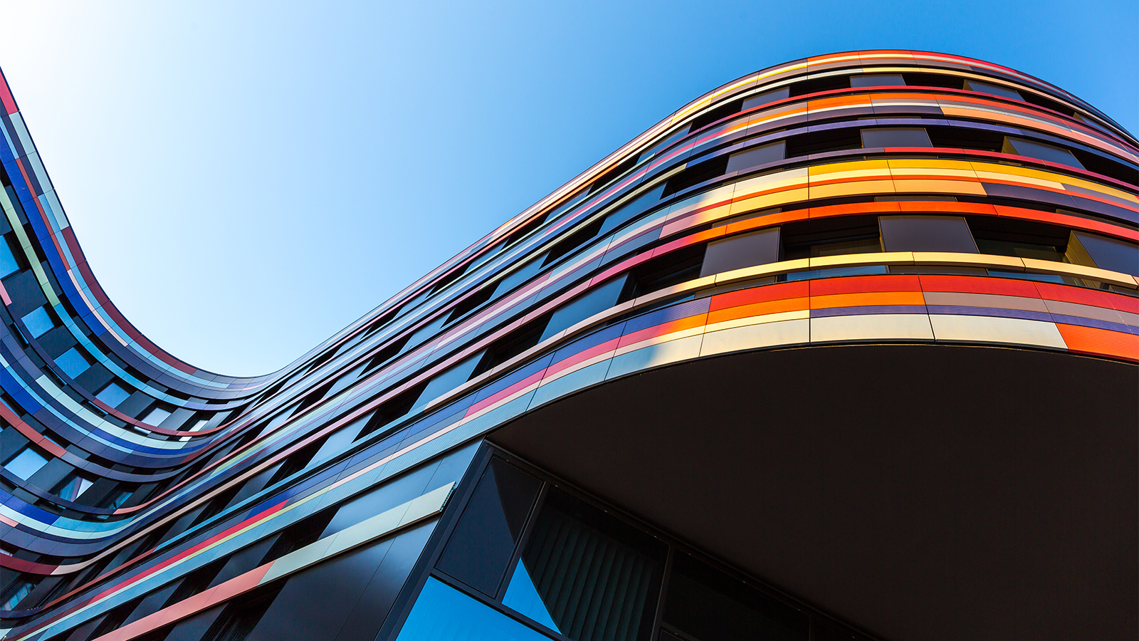 upward shot of a colourful corporate building