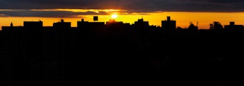 A sun setting over the city.