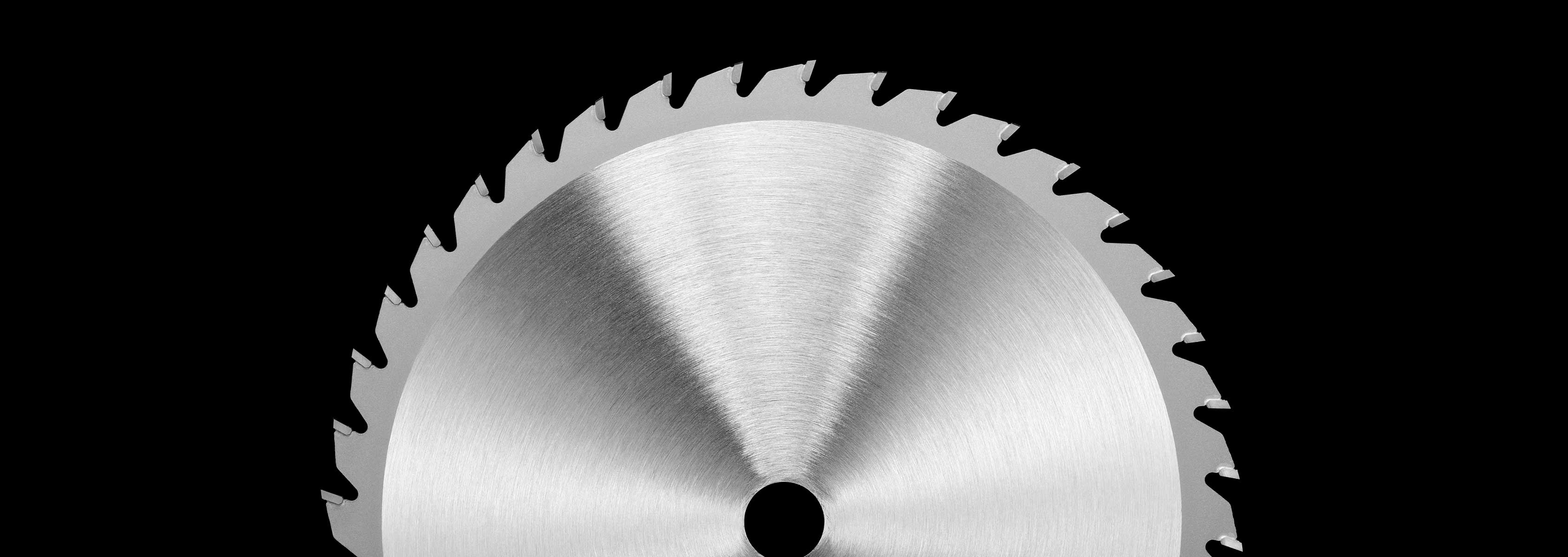 A circular blade on a black background.