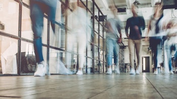 people walking in modern office